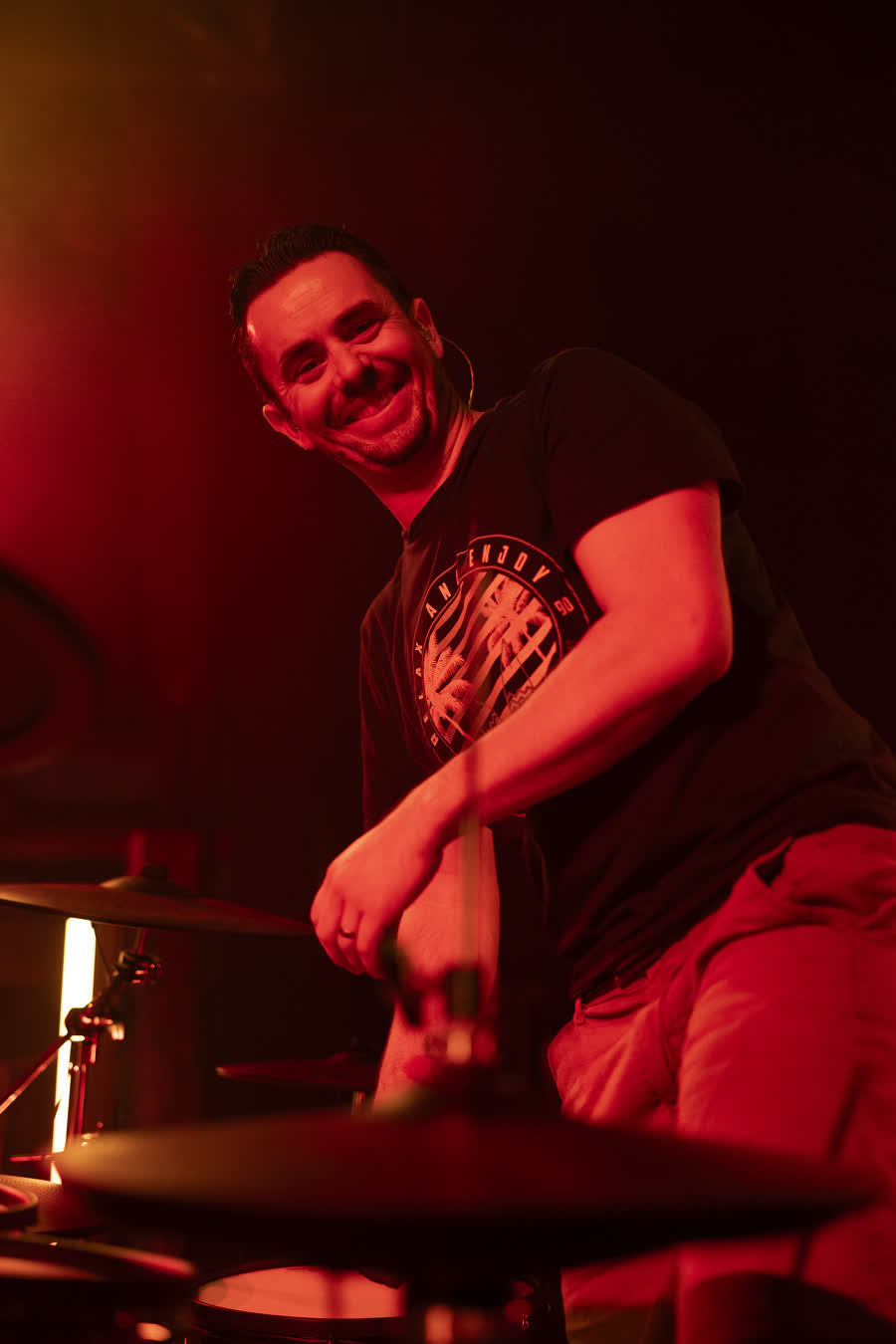Drummer under red light